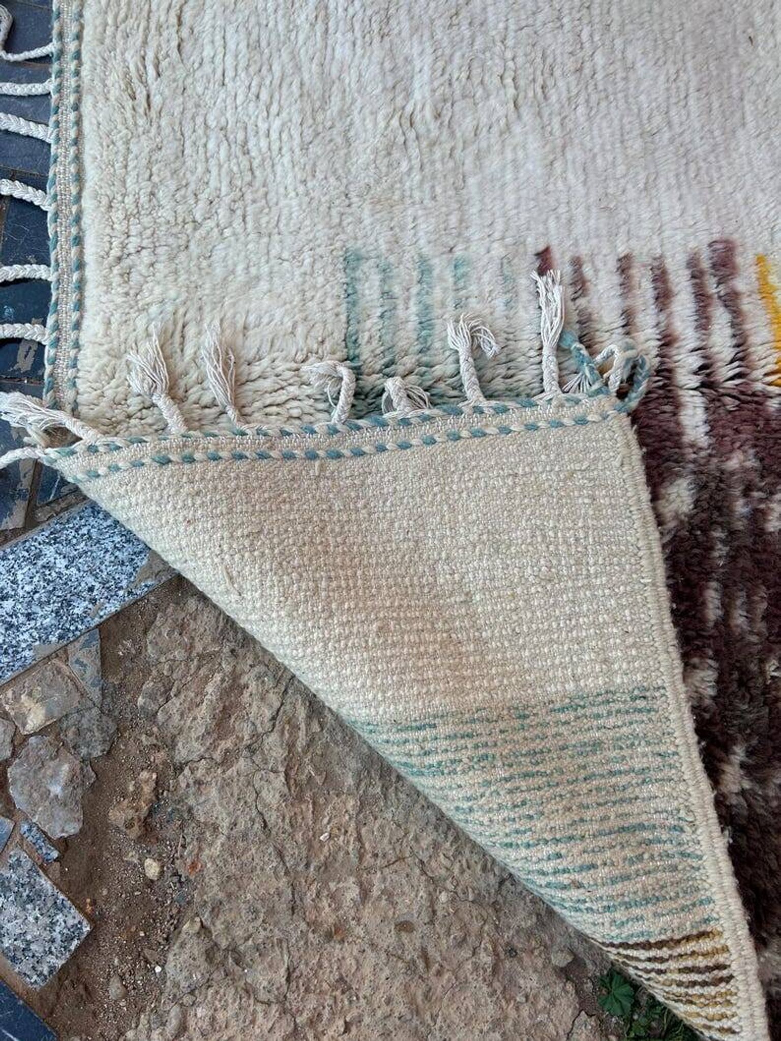 Handmade traditional pure wool rug with colourful patterns.