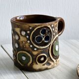 Signed ceramic mug.