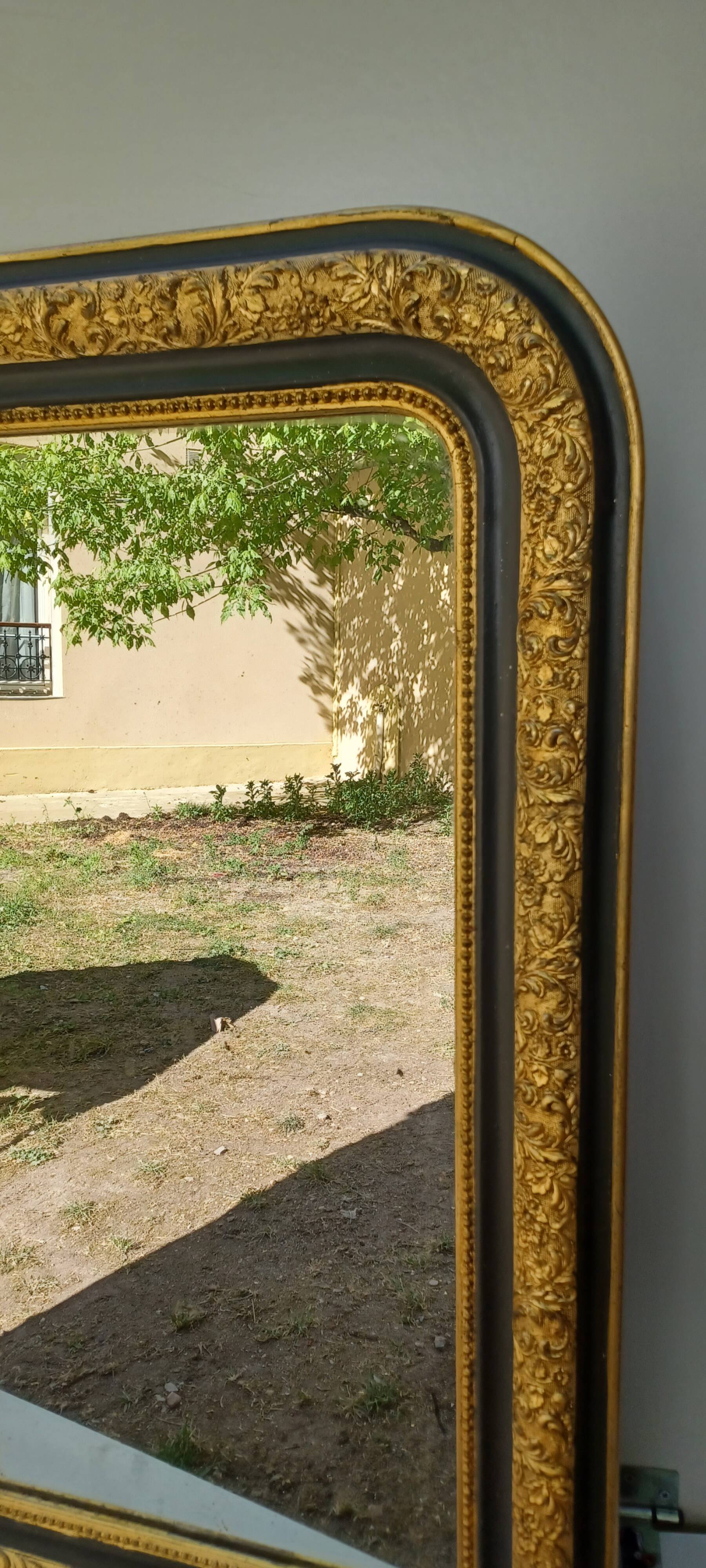 Louis-Philippe mirror, gilded and grey patina, circa 1890.