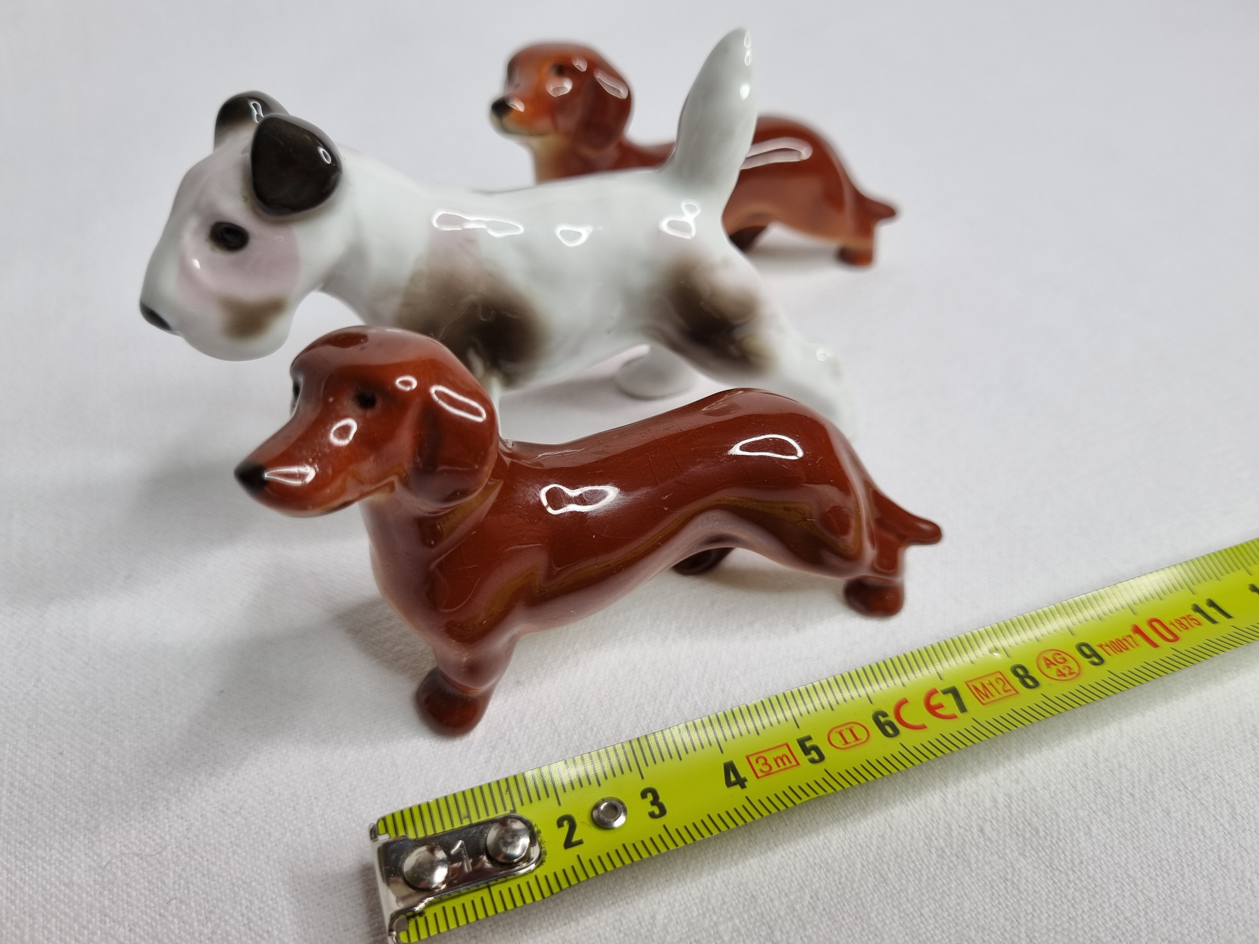 Set of three porcelain puppies