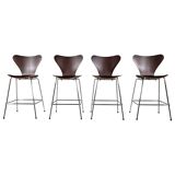 Set of 4 brown oak plywood bar stools by Fritz Hansen Series 7 by Arne Jacobsen.
