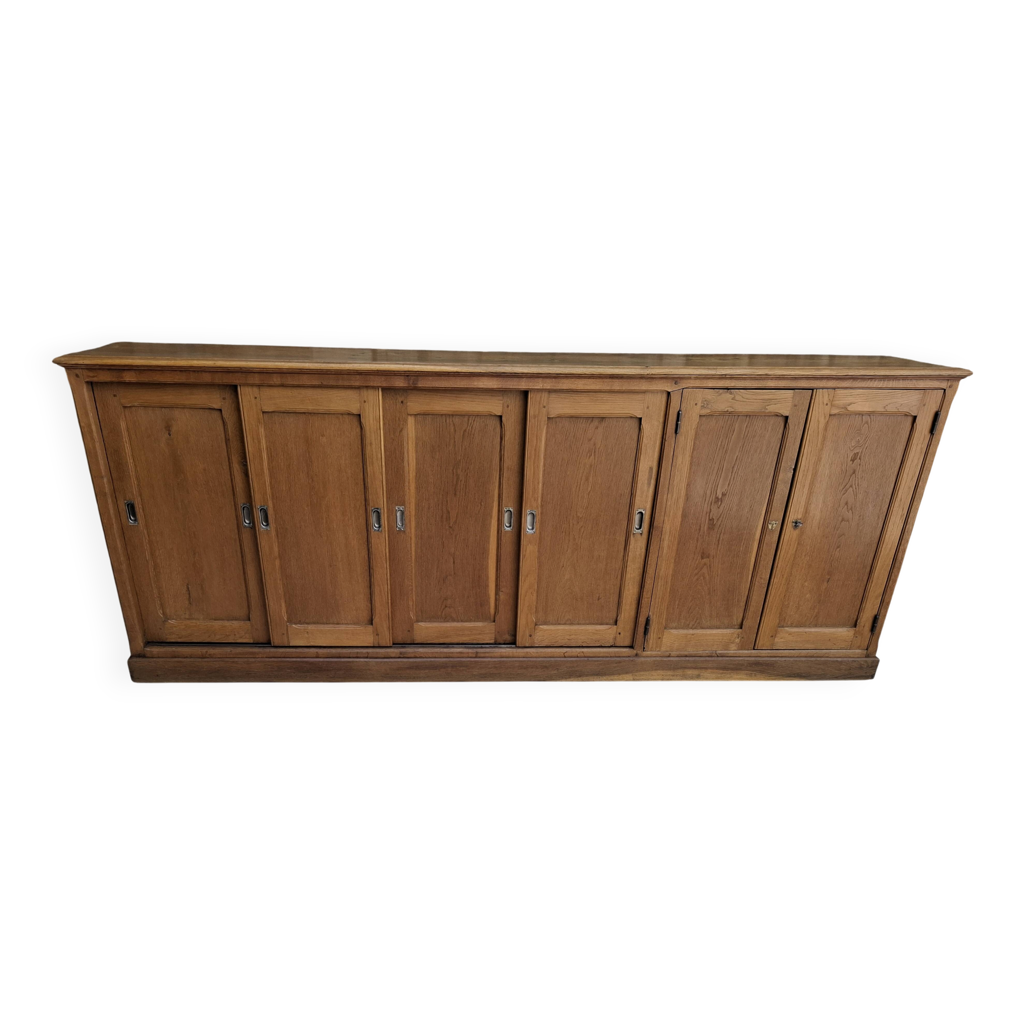 Oak workshop furniture with sliding doors.