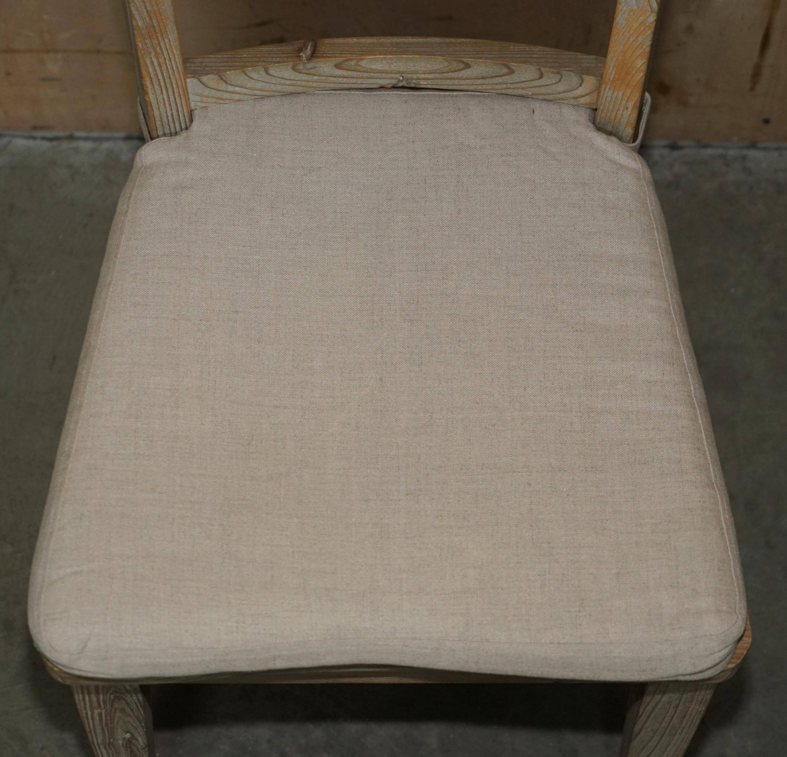 Pair of Swedish-style accent chairs in recycled pine with upholstered seats.