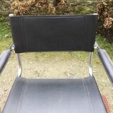 Design armchair with chrome metal tubular base and seat in black Skaï
