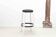 Alvar Aalto 64 stool upholstered in black and white for Artek.
