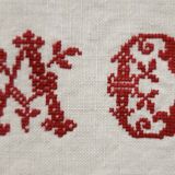 AC monogrammed linen campaign sheet at cross point