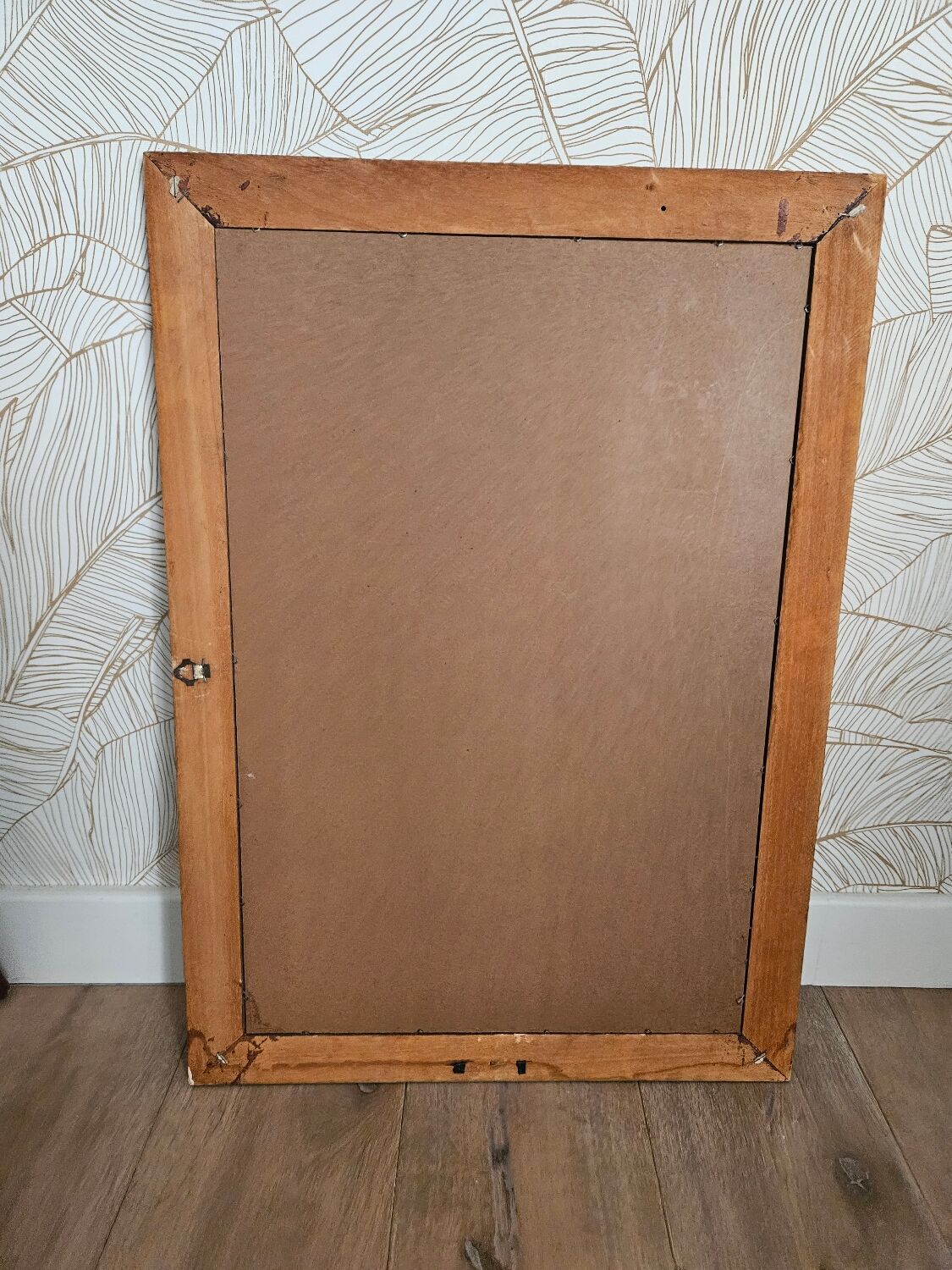 Beveled glass mirror in its wooden frame