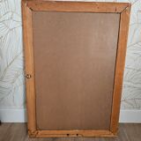 Beveled glass mirror in its wooden frame