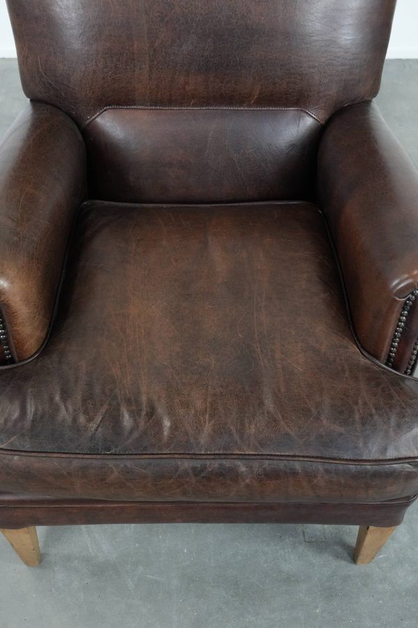 Characterful sheep leather armchair with a beautiful deep colour
