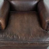 Characterful sheep leather armchair with a beautiful deep colour