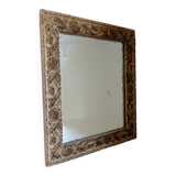 Wood and patinated stucco mirror