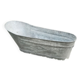 Antique children's bathtub in zinc