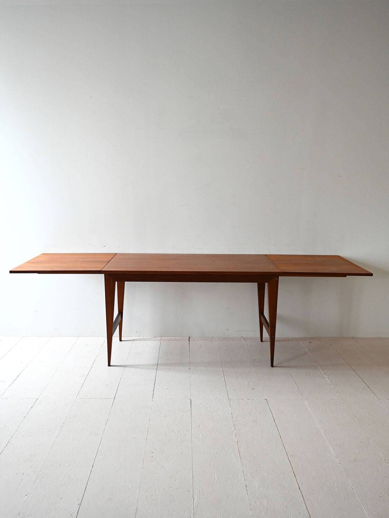 Vintage teak table by ISA Bergamo with drop-leaf extensions