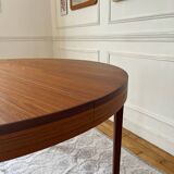 Round extendable rosewood table from the 70s