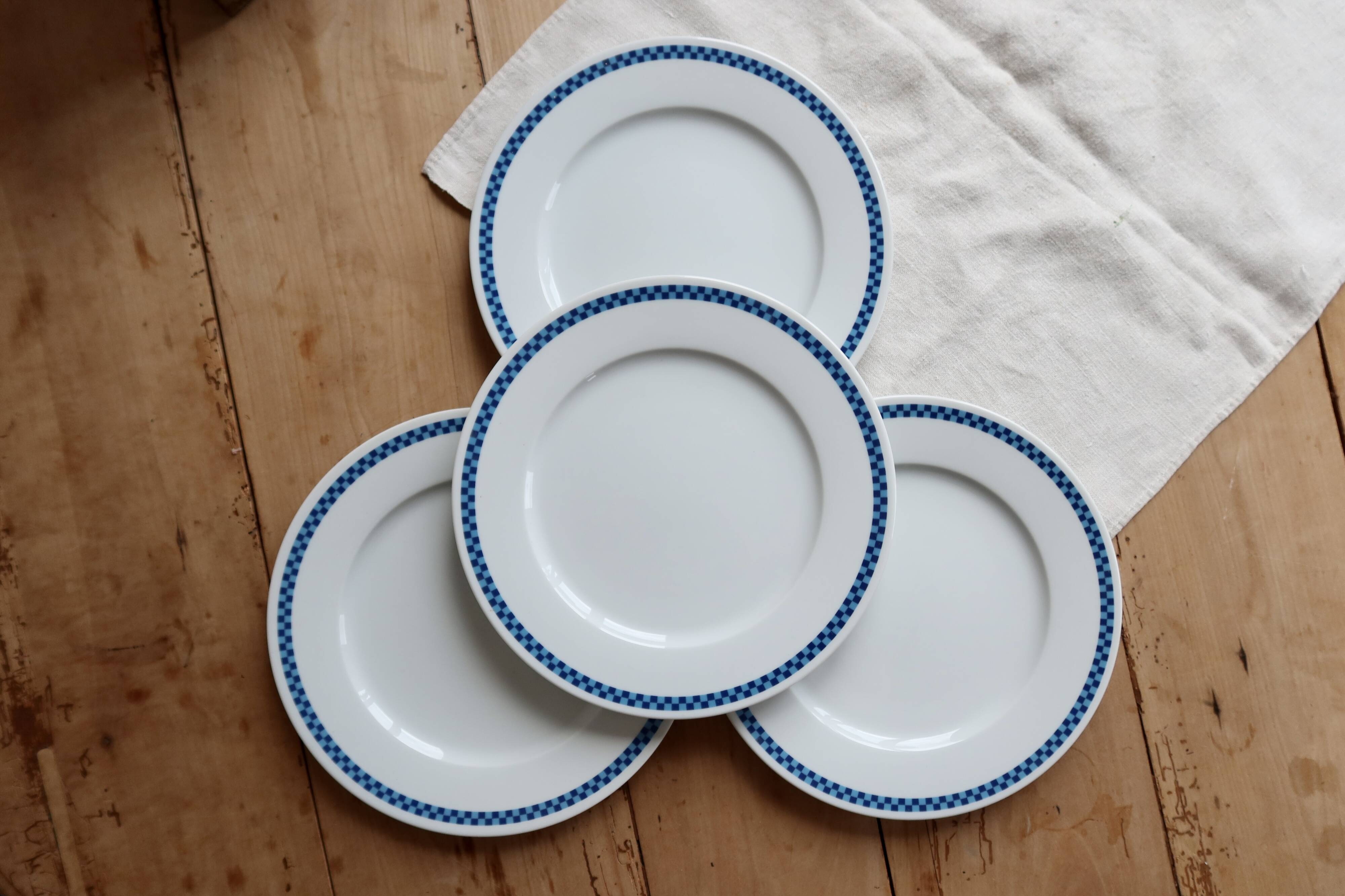 4 vintage Lustucru plates in porcelain with a blue checkered pattern.