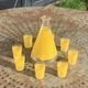 Liqueur service composed of a glass carafe and 8 small yellow screen-printed glasses