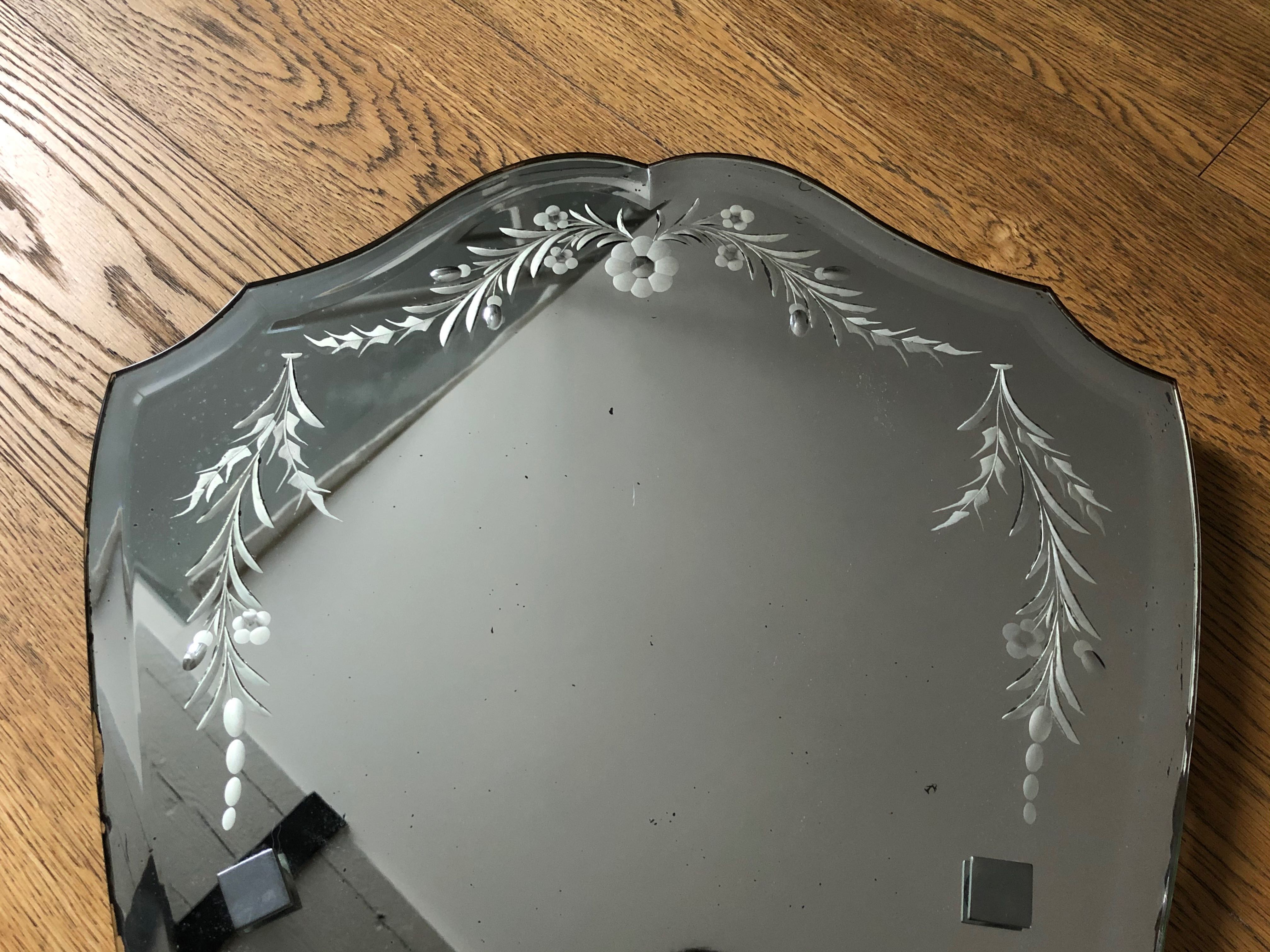 Old bevelled and engraved mirror   43x63cm