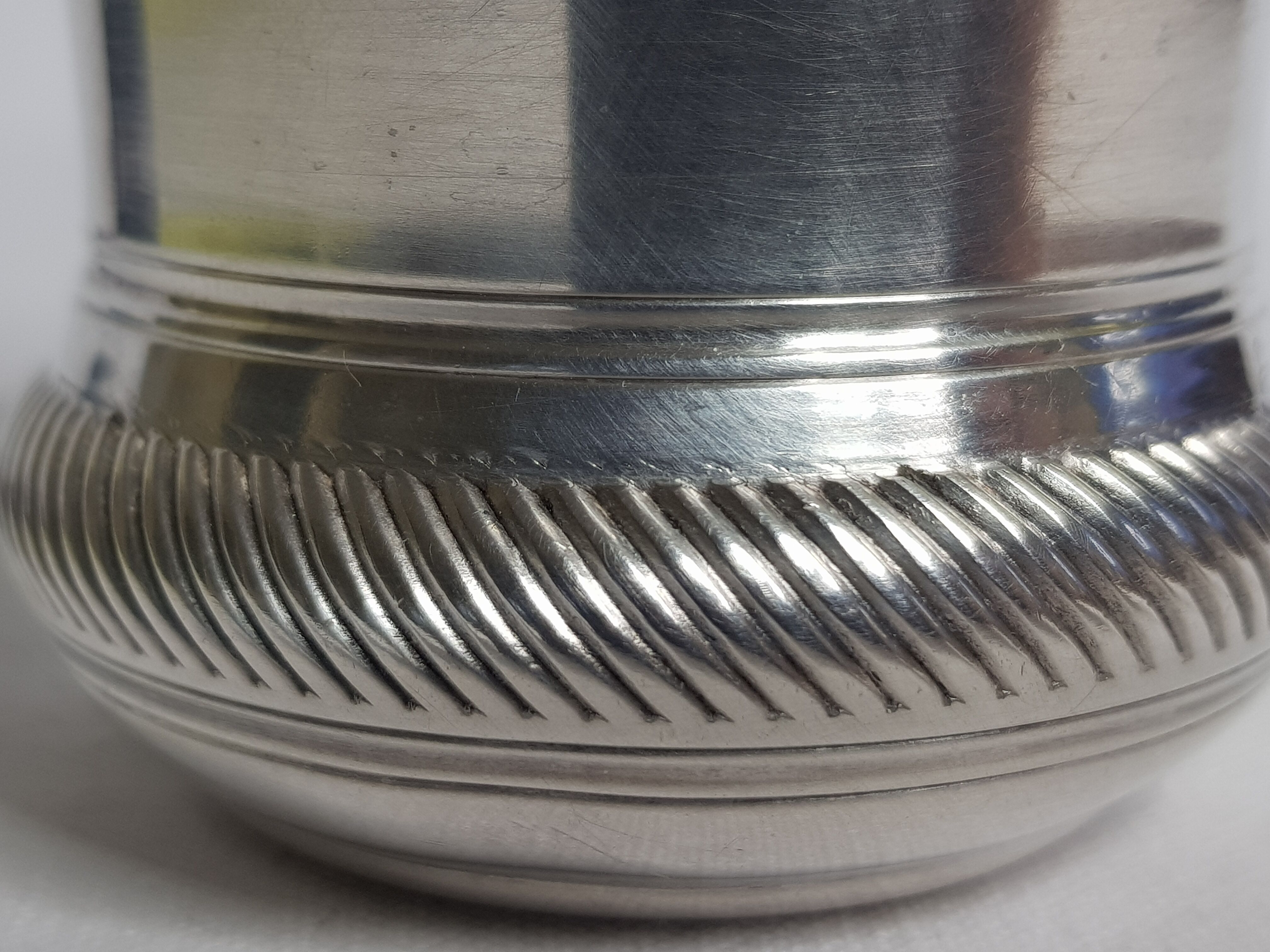 Old silver metal timbale with punch