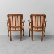 Pair of Parisian-style armchairs in wood with striped fabric armrests, vintage