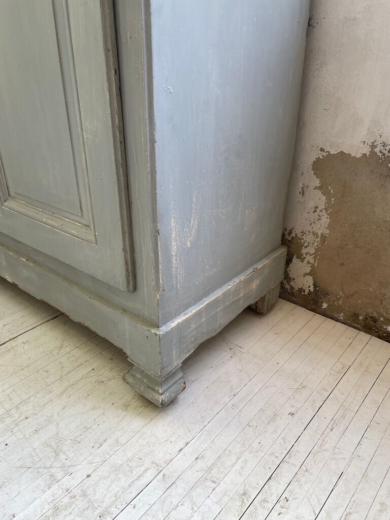 Blue patinated cap cabinet