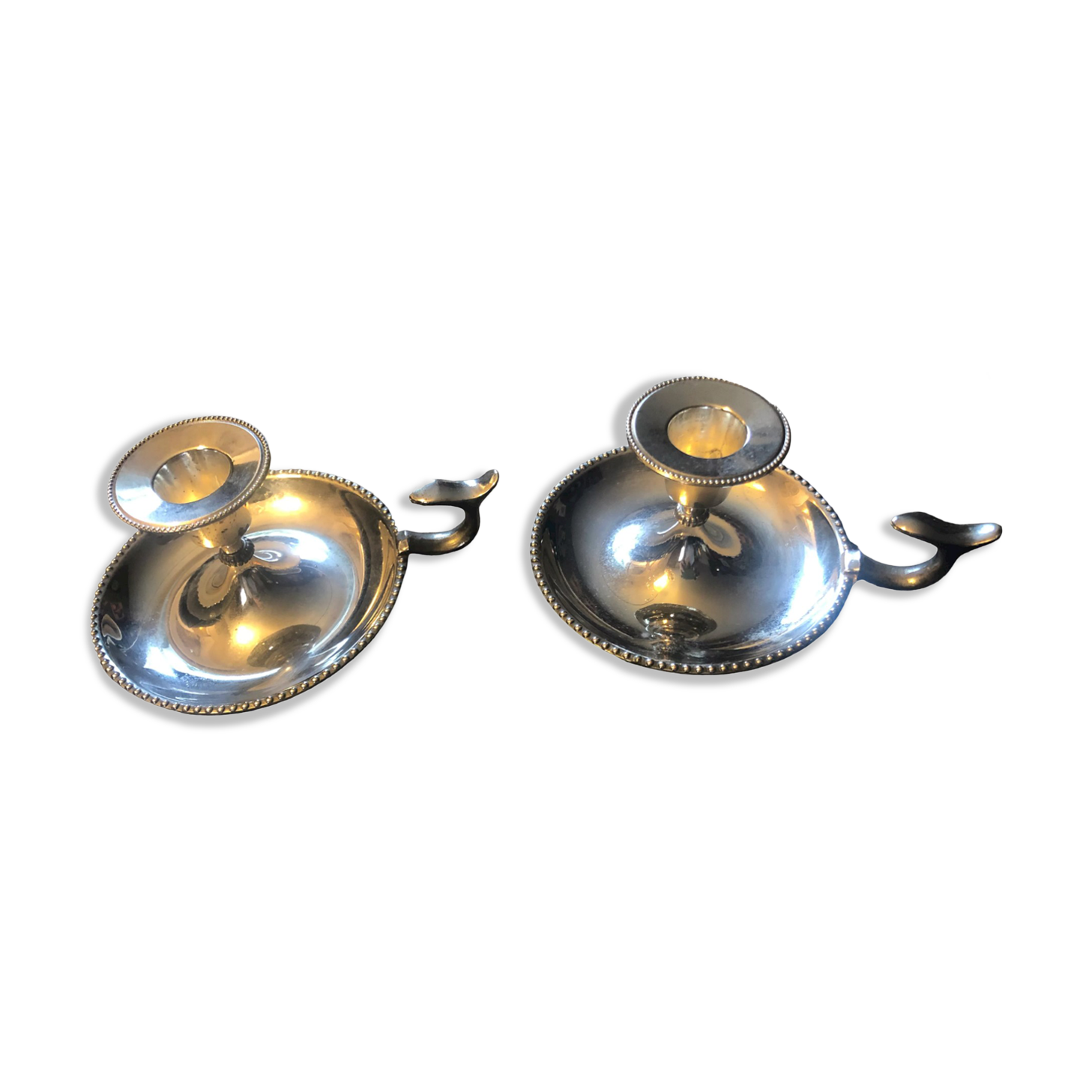 Pair of silver metal hand candle holders