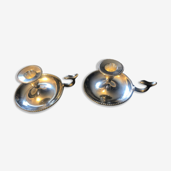 Pair of silver metal hand candle holders