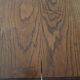 Solid wood dining table with a sculptural base.