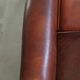 Sheepskin club armchair in English style with brown colour scheme