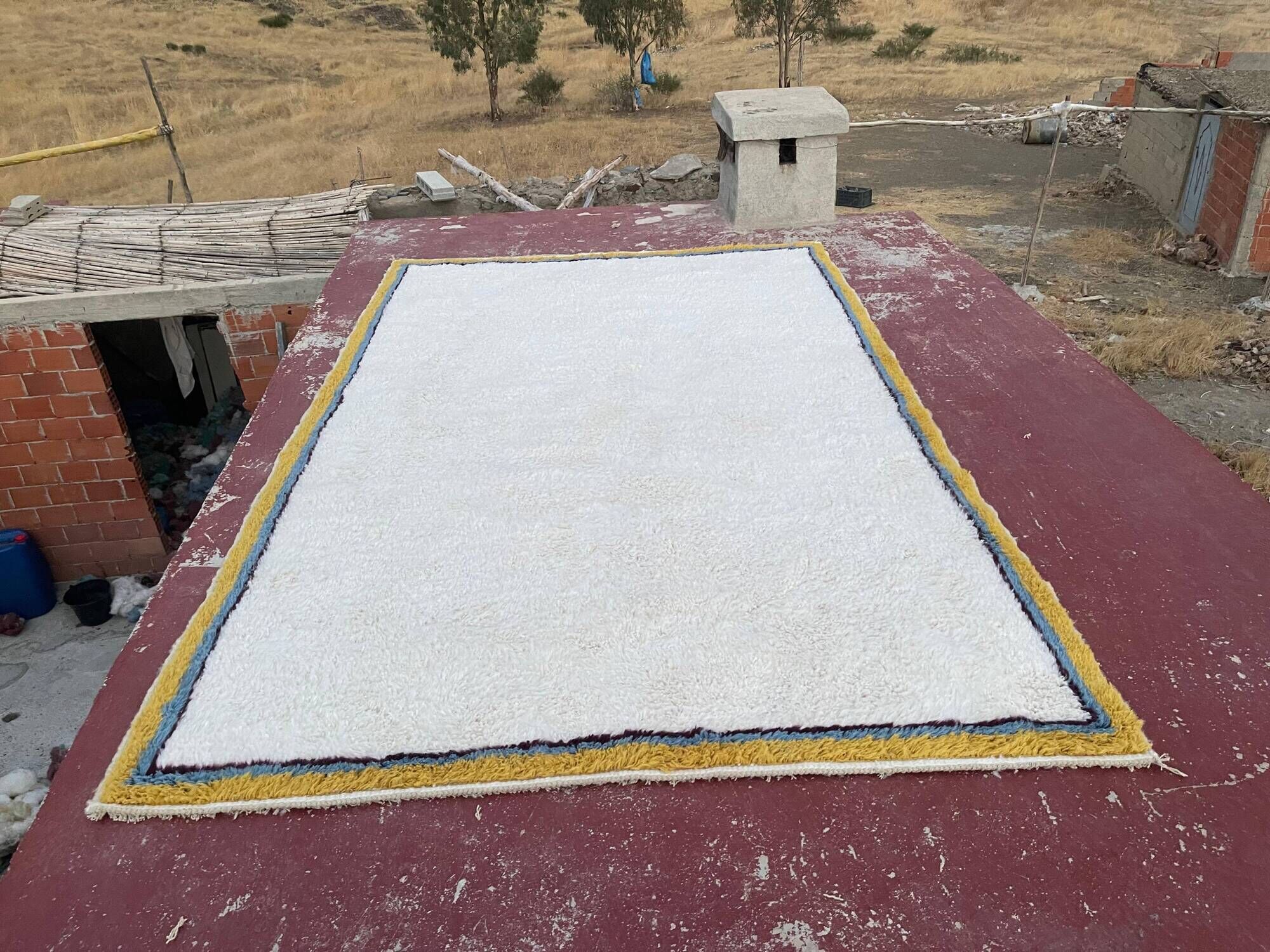 Large Moroccan Berber rug in cream 400x250 cm – yellow and blue border