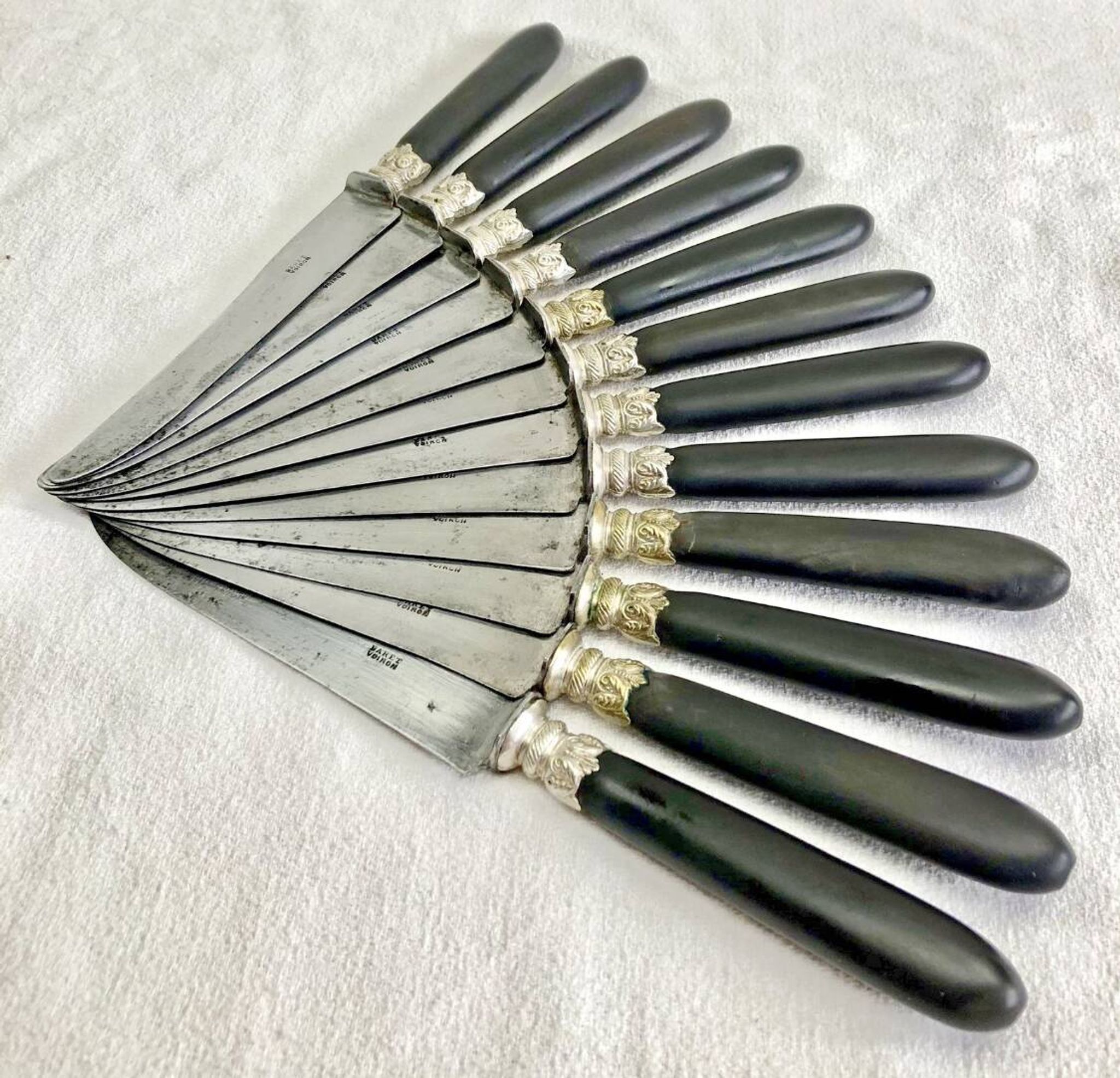 12 antique large table knives with ebony handles from the Napoleonic III period.