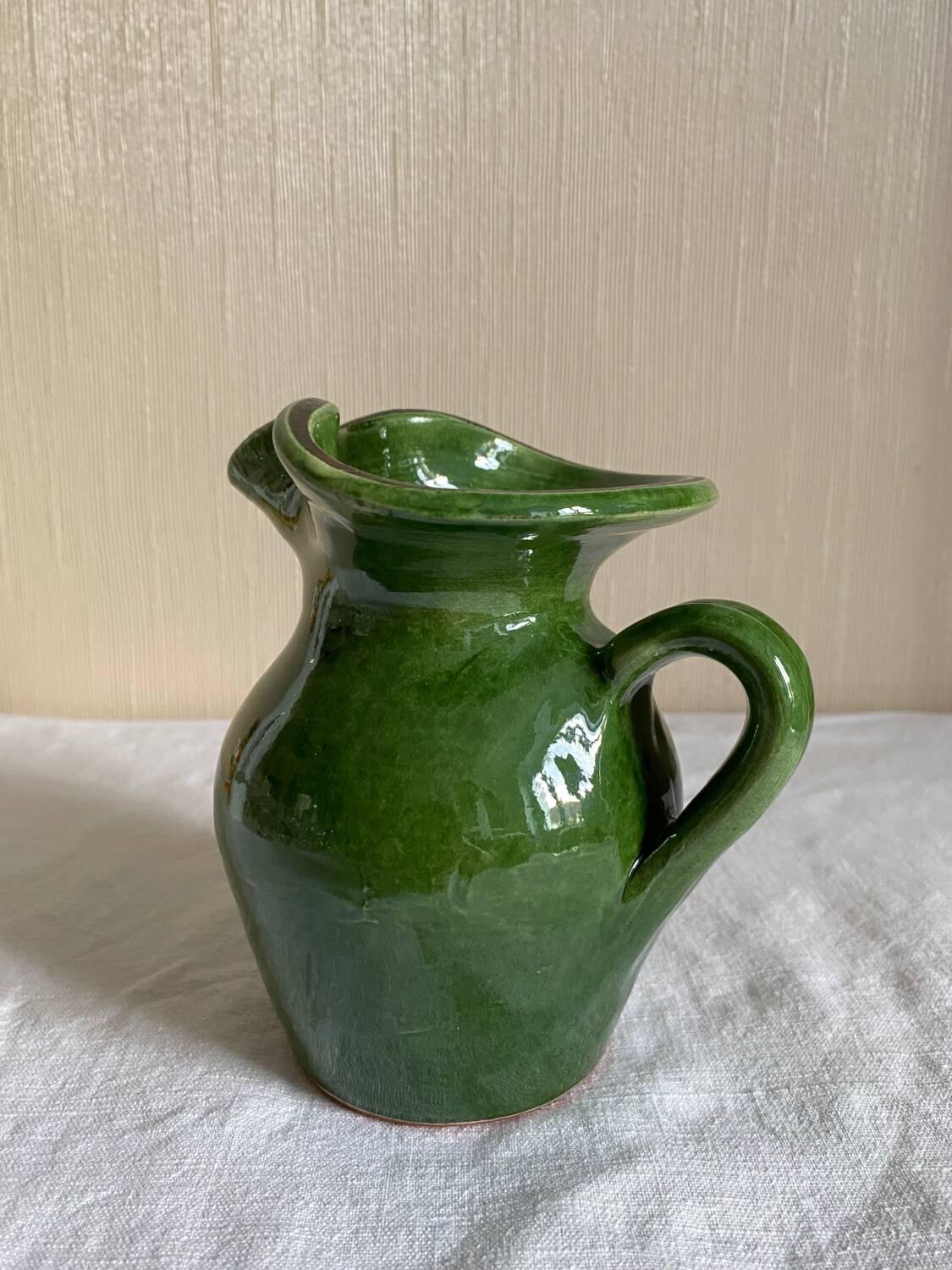 Provençal pitcher in green glazed earthenware