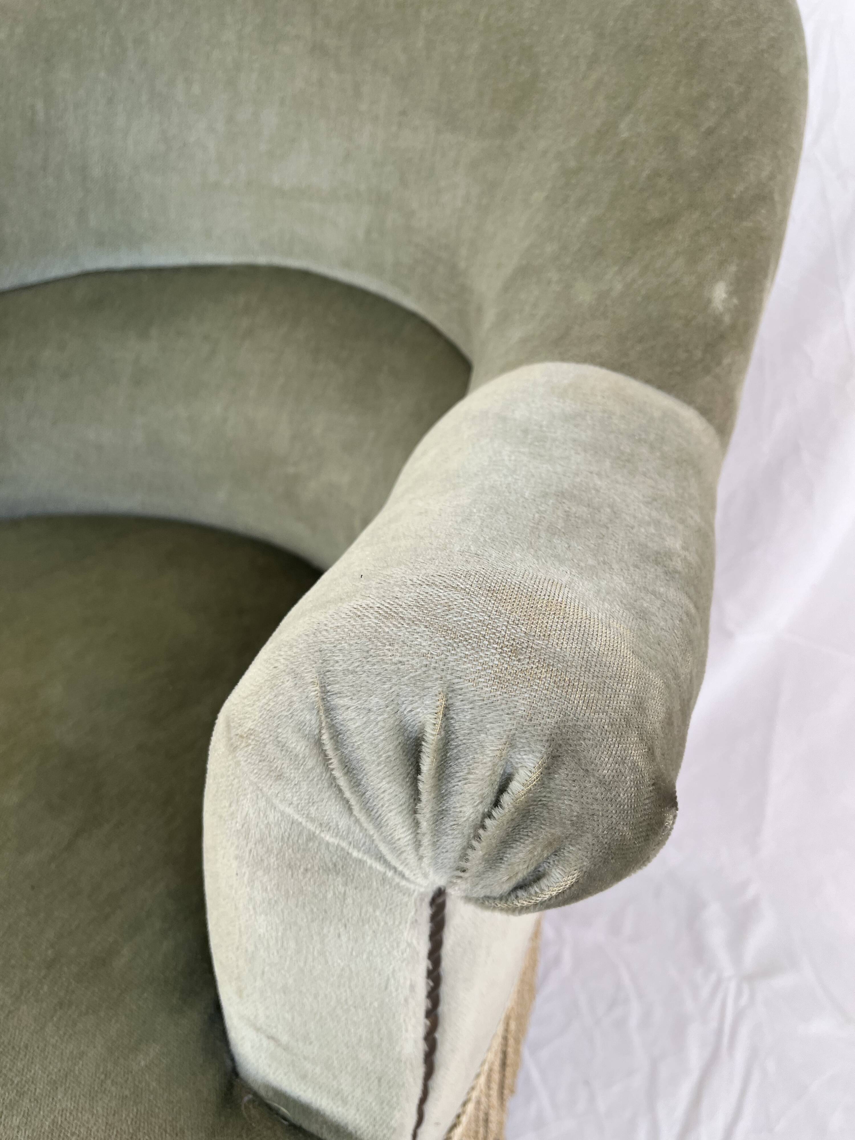 sage green toad armchairs with gold fringe