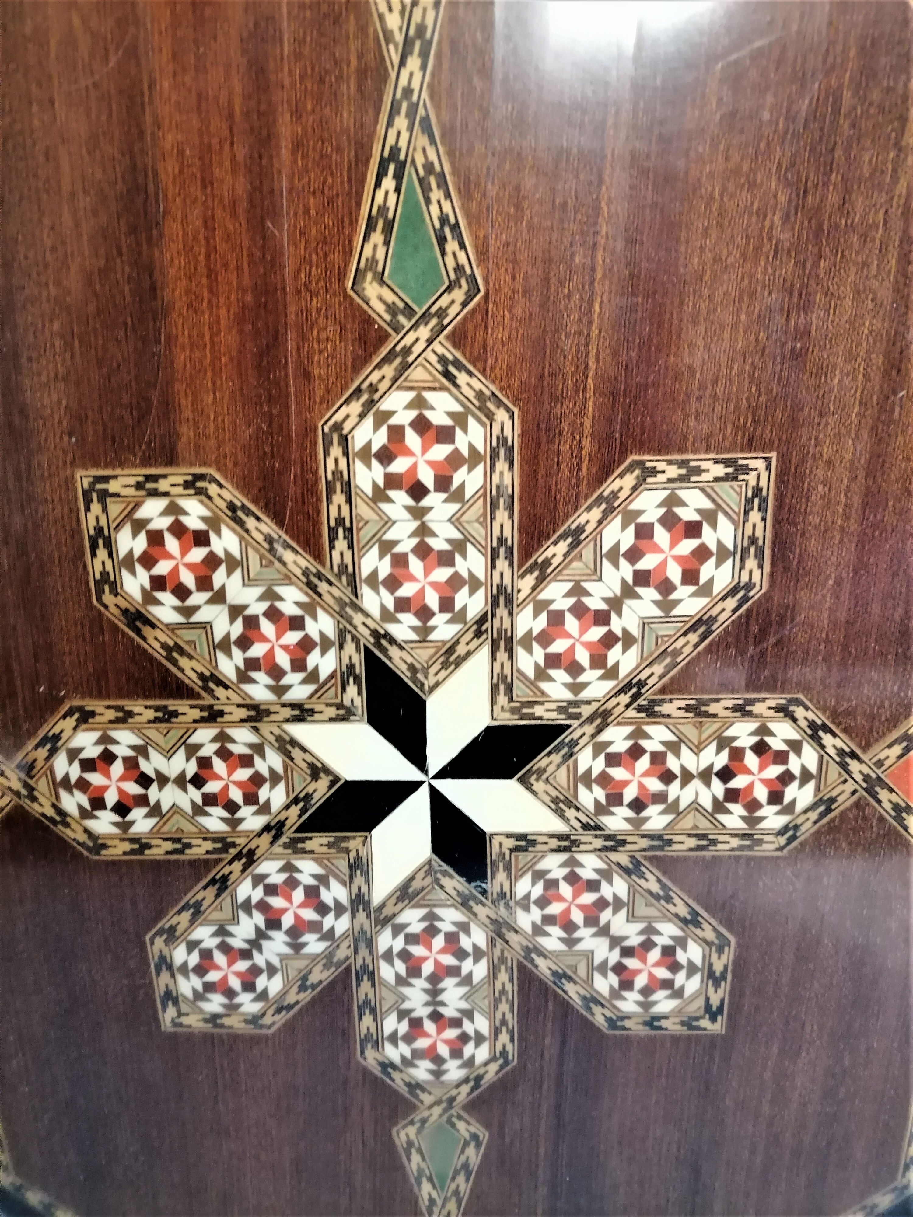 Old oriental plateau in marquetry.