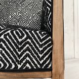 Club armchair in wood and fabric.