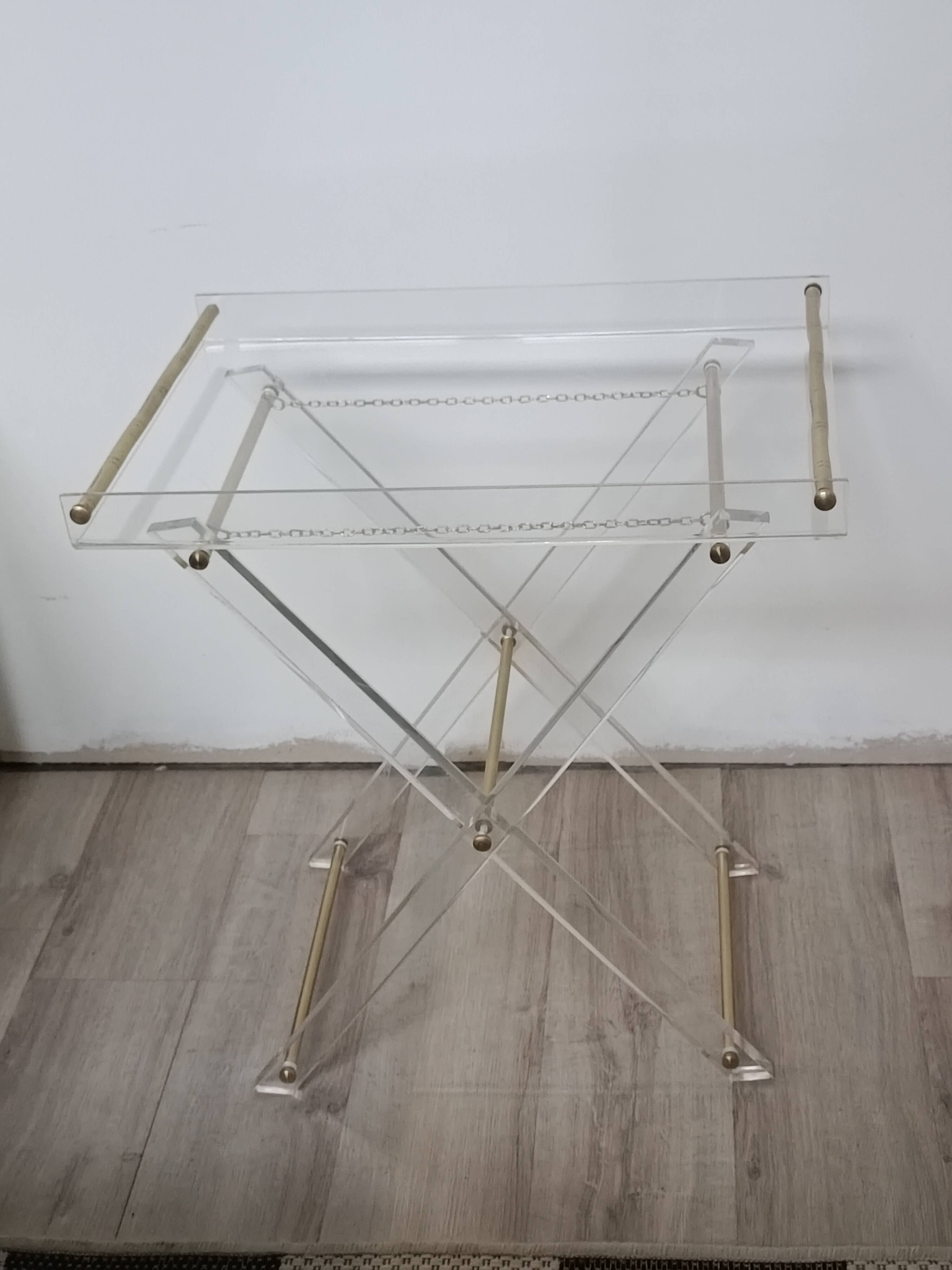 Folding side table in plexiglass and brass, 1970s.