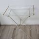 Folding side table in plexiglass and brass, 1970s.