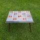 Small 1960s enamelled table, spindle legs, signed jd.