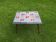 Petite table annees 60 émaillée, pieds fuseau, signée jd