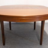 Scandinavian round extendable teak table, 60s-70s
