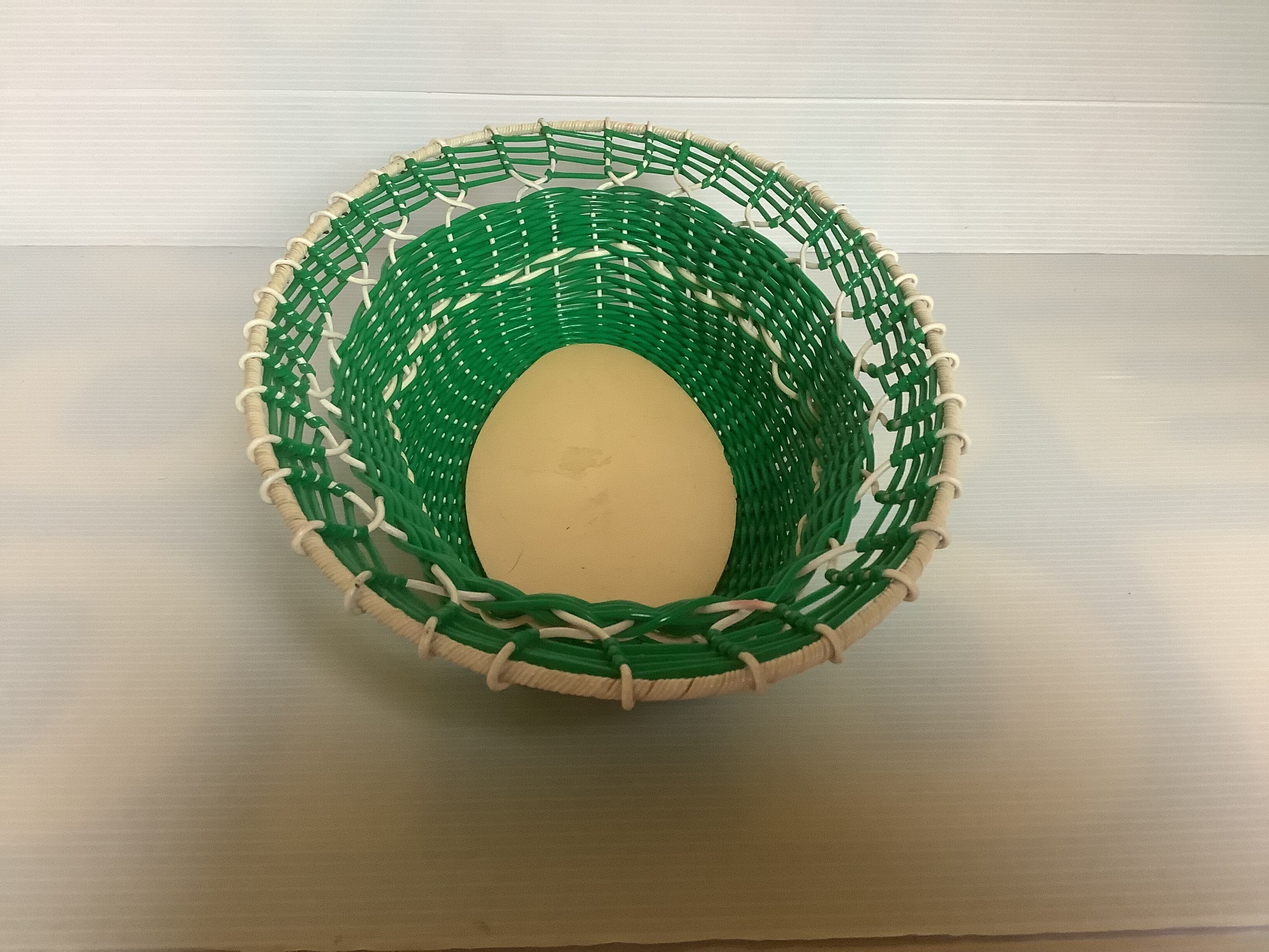 Old green scoubidou basket