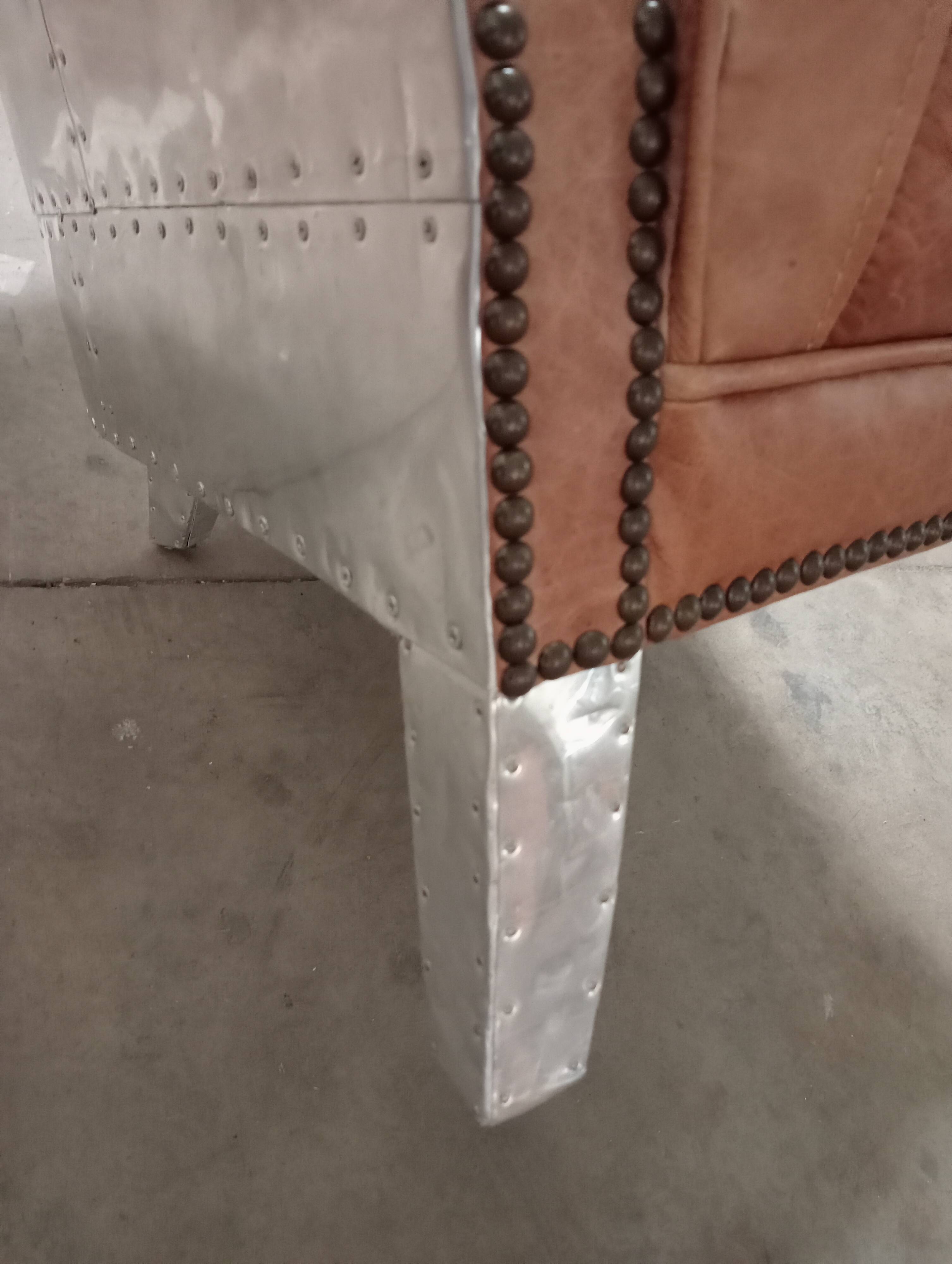 2 aviator armchairs