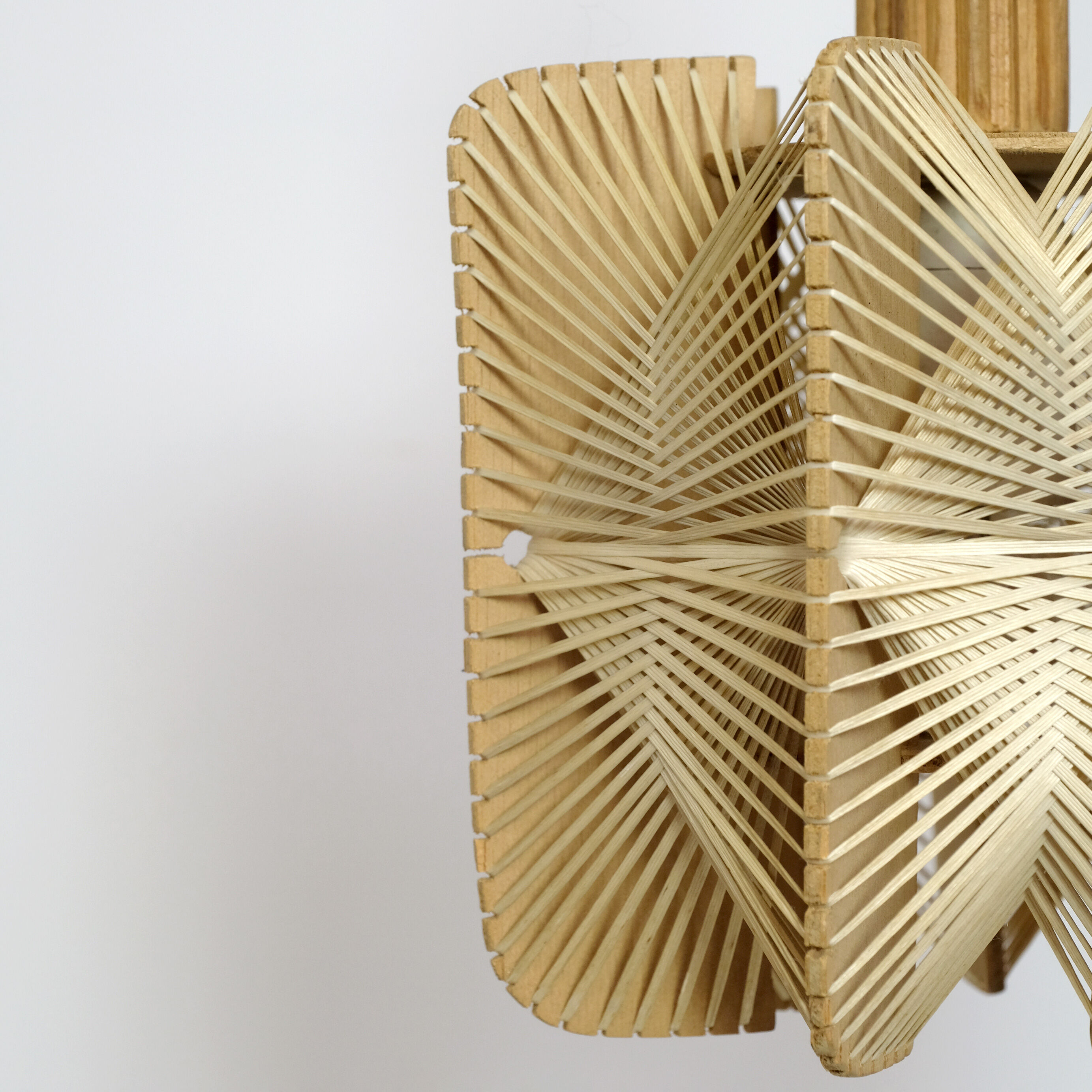 Hanging lamp in wood and threads of the 70