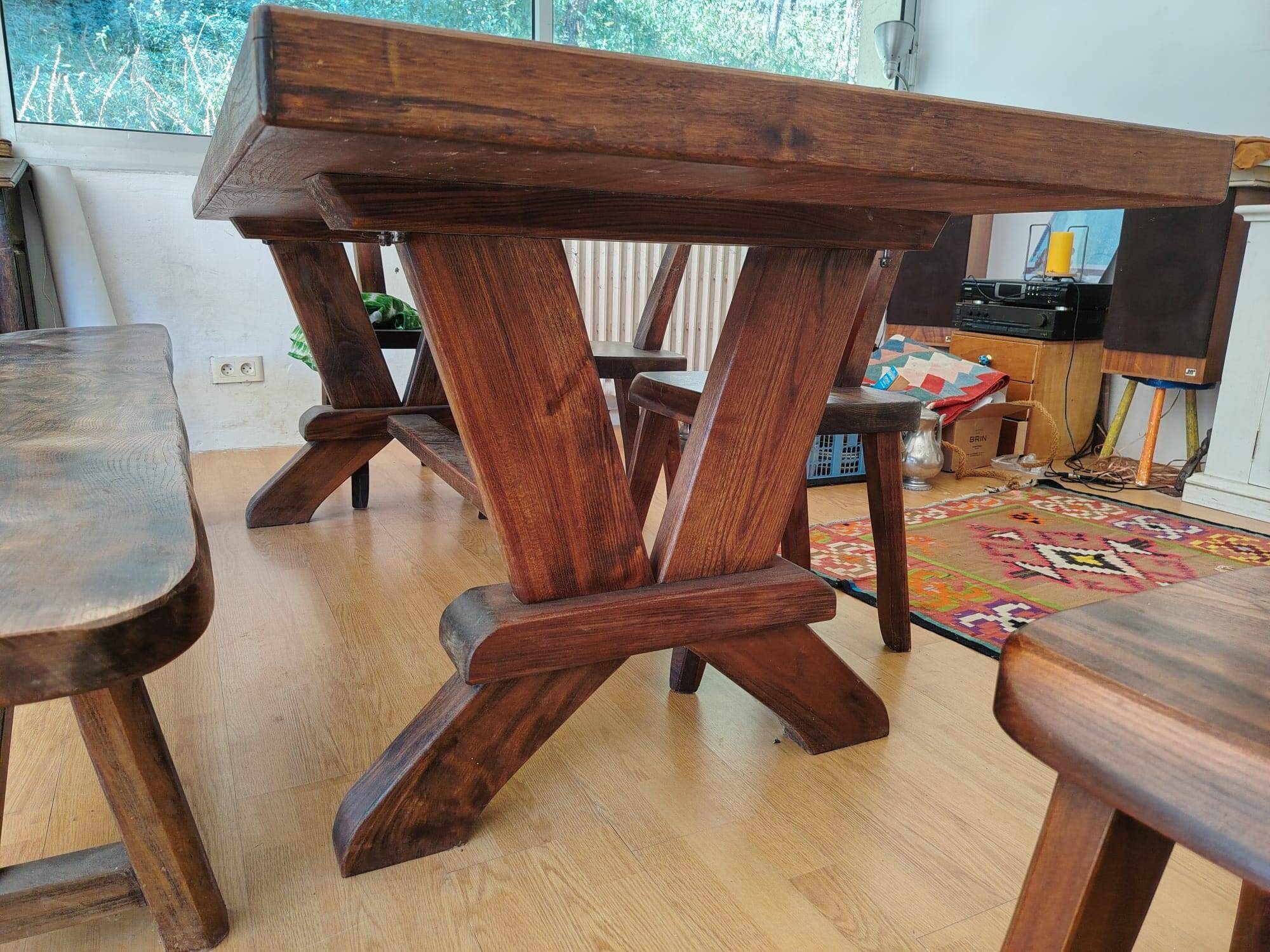 Set table, 4 chairs and a brutalist bench in the Regain style.