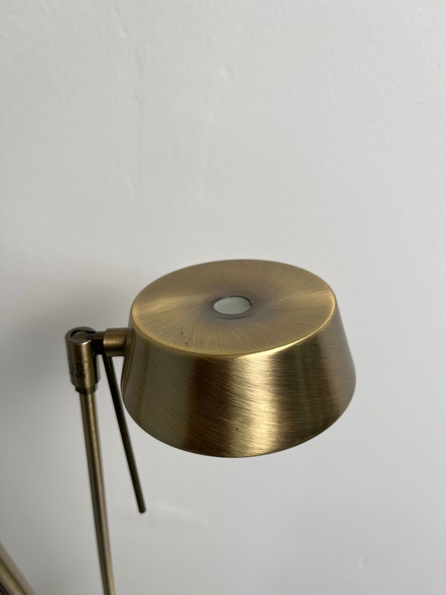 Golden metal floor lamp with reading light