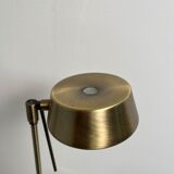 Golden metal floor lamp with reading light