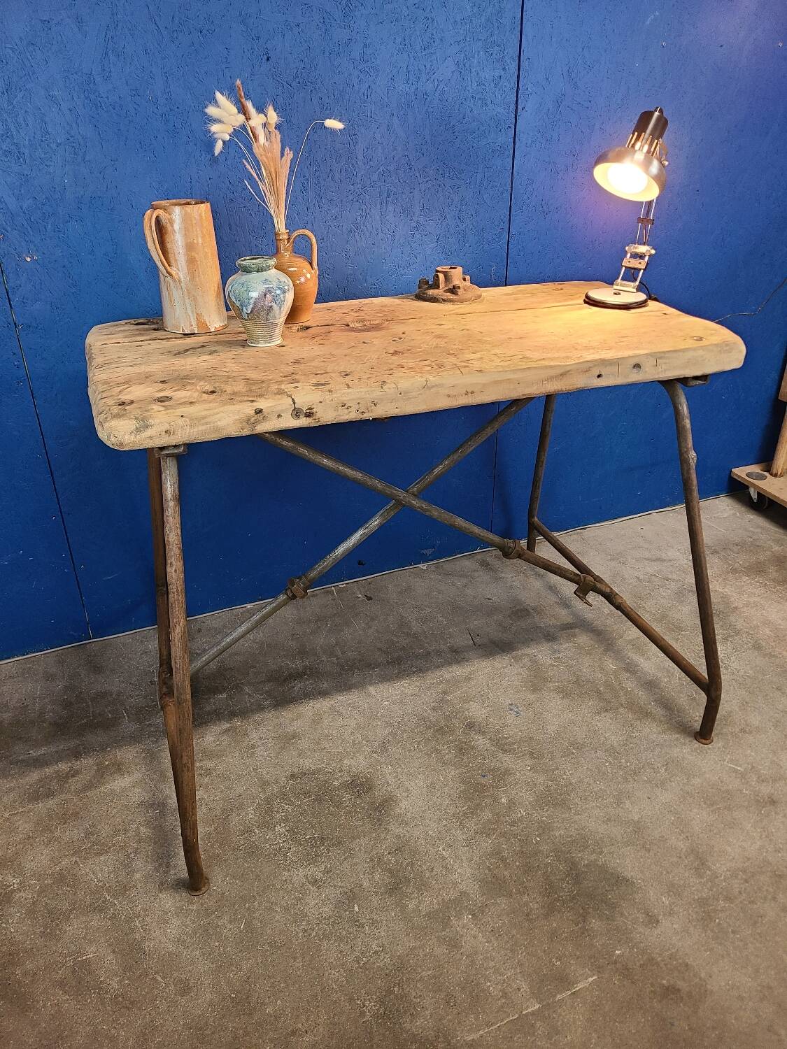 Vintage workbench circa 1930, folding metal leg.