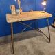 Vintage workbench circa 1930, folding metal leg.