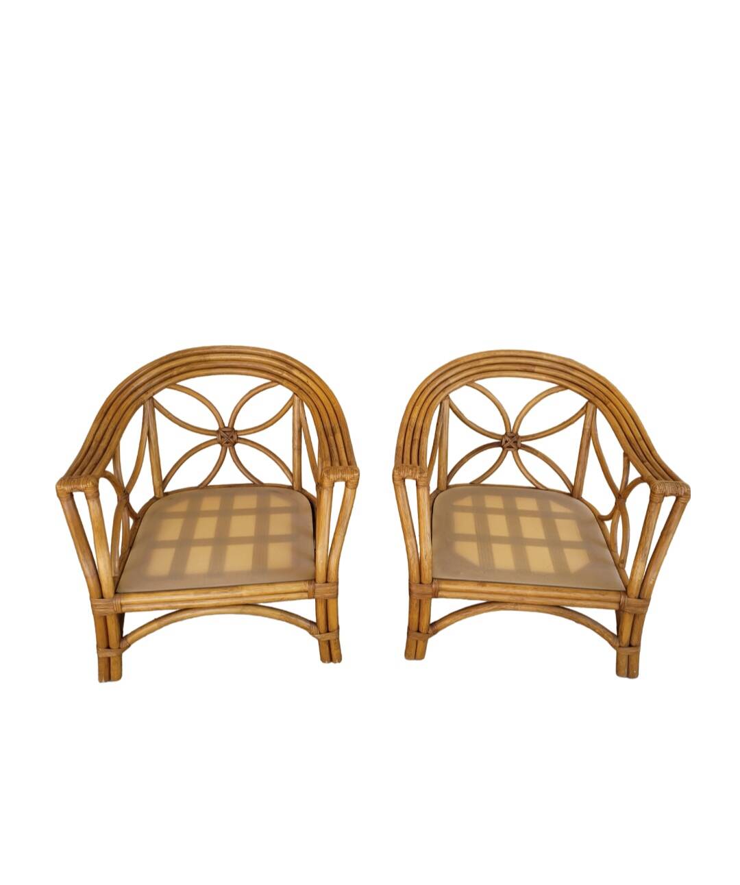 Two large rattan armchairs