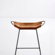 Pair of contemporary bar stools in cognac and smoked black.