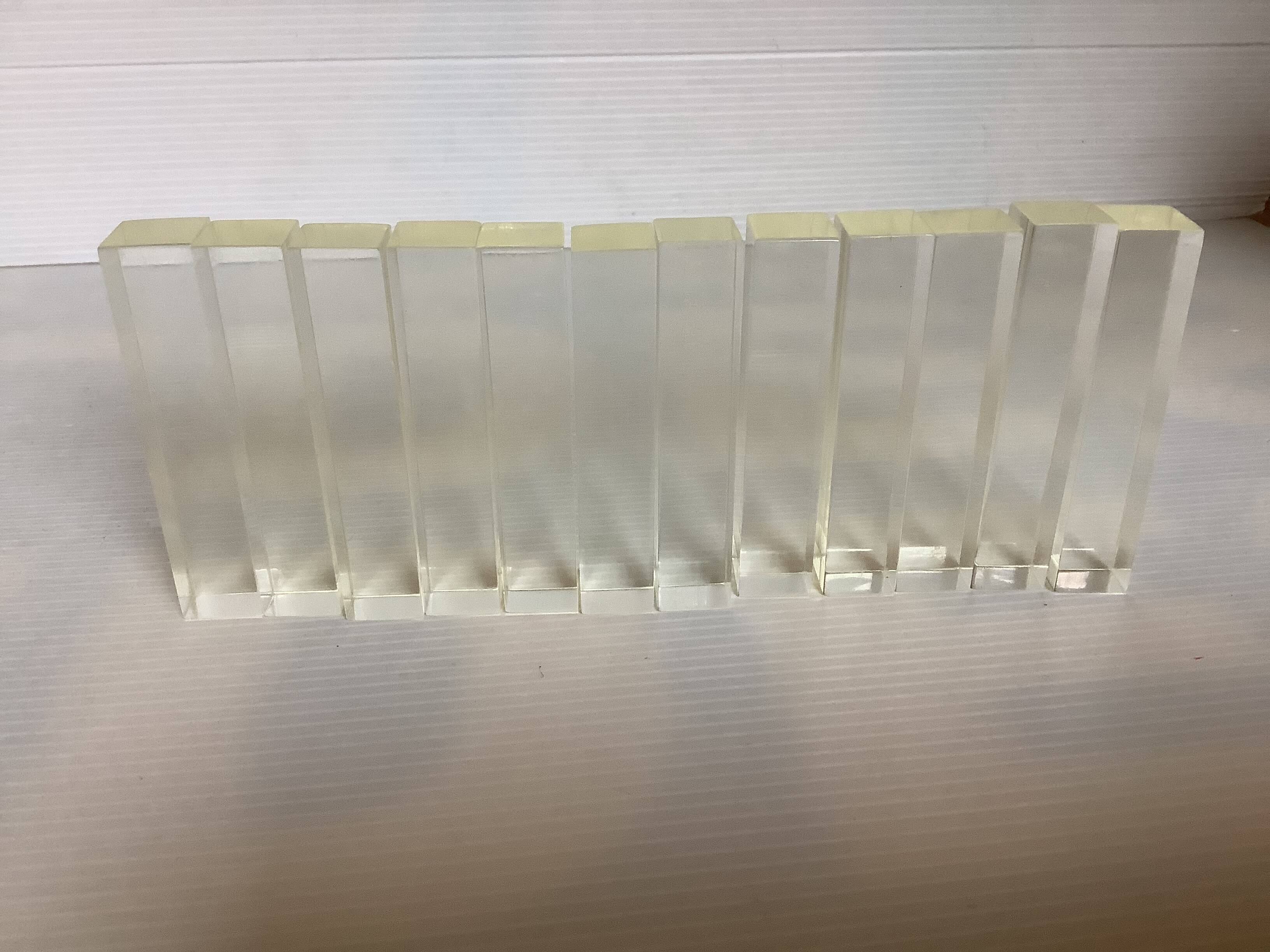 Twelve old lucite knife holders